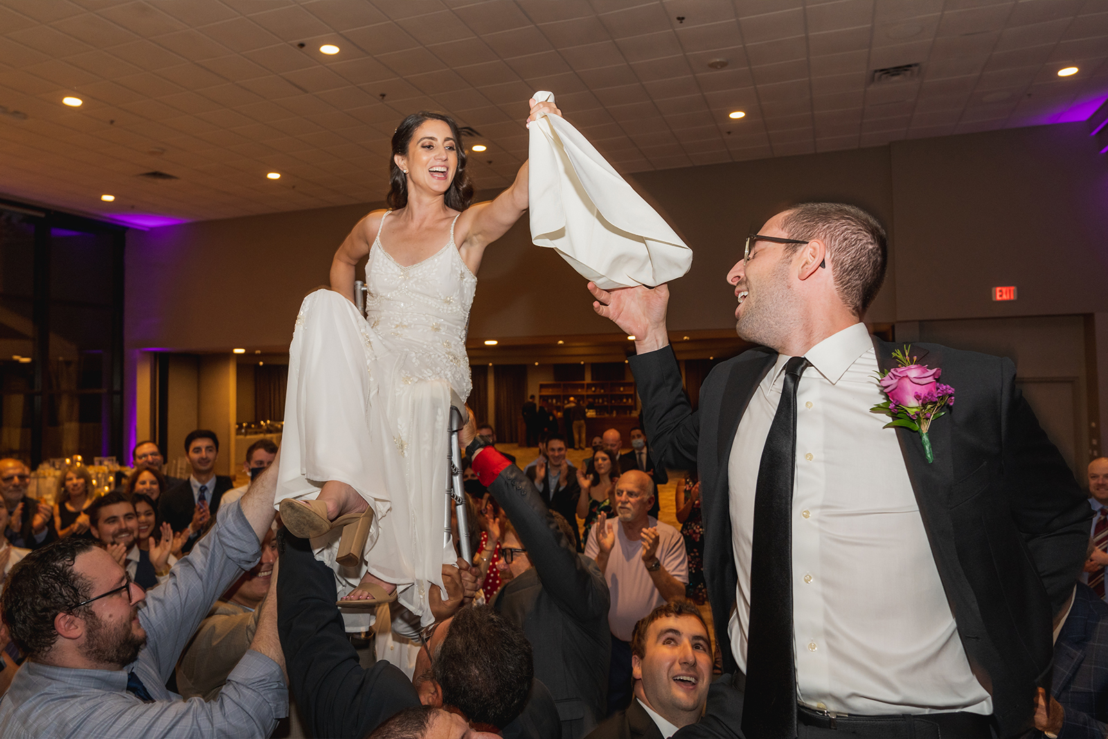 Bride and groom in chairs, dance, fun, candid wedding photo, Jewish wedding, classy wedding ceremony at Landerhaven, Mayfield Heights OH