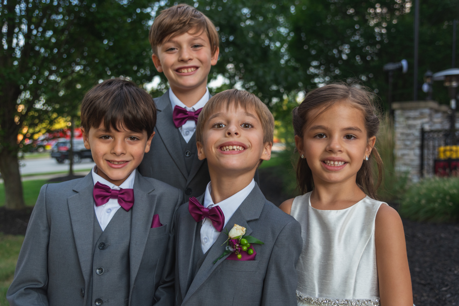 Children smiling, ring bearers, flower girl, bridal party portrait, nature, green trees, sweet wedding reception at Crocker Park, Westlake OH