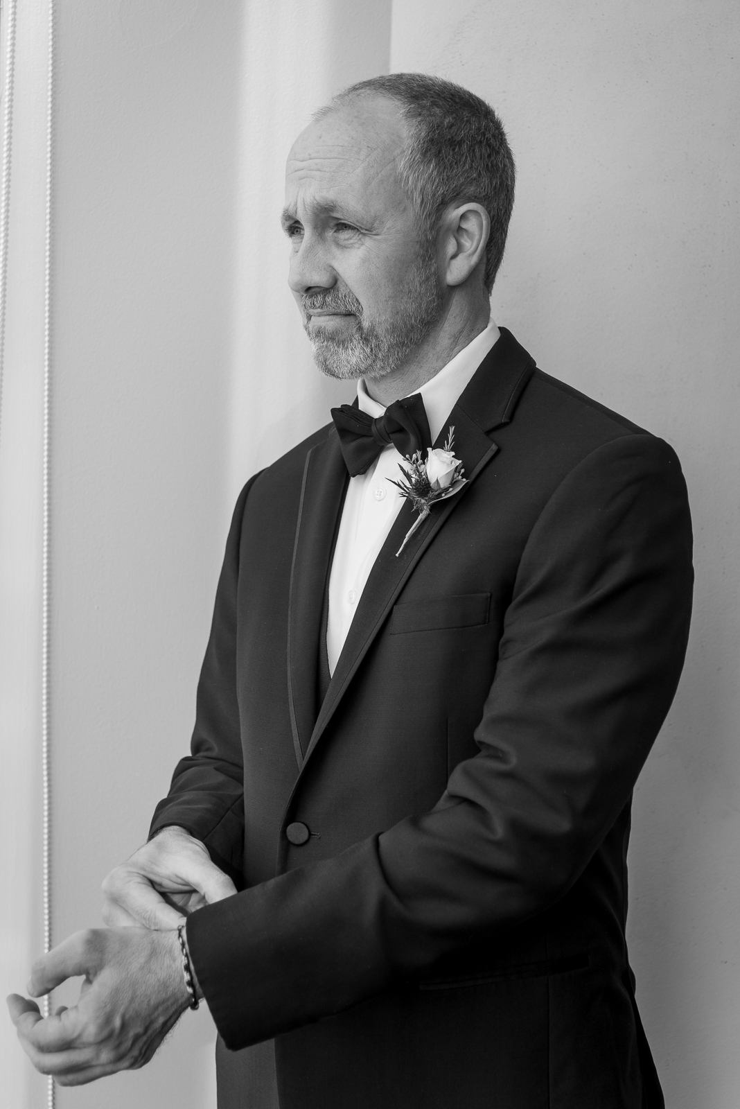 Groom getting ready, wedding preparation, groom portrait, serious, stately, black and white, classic look, older groom, urban wedding ceremony at Penthouse Events, Ohio City, Cleveland Flats