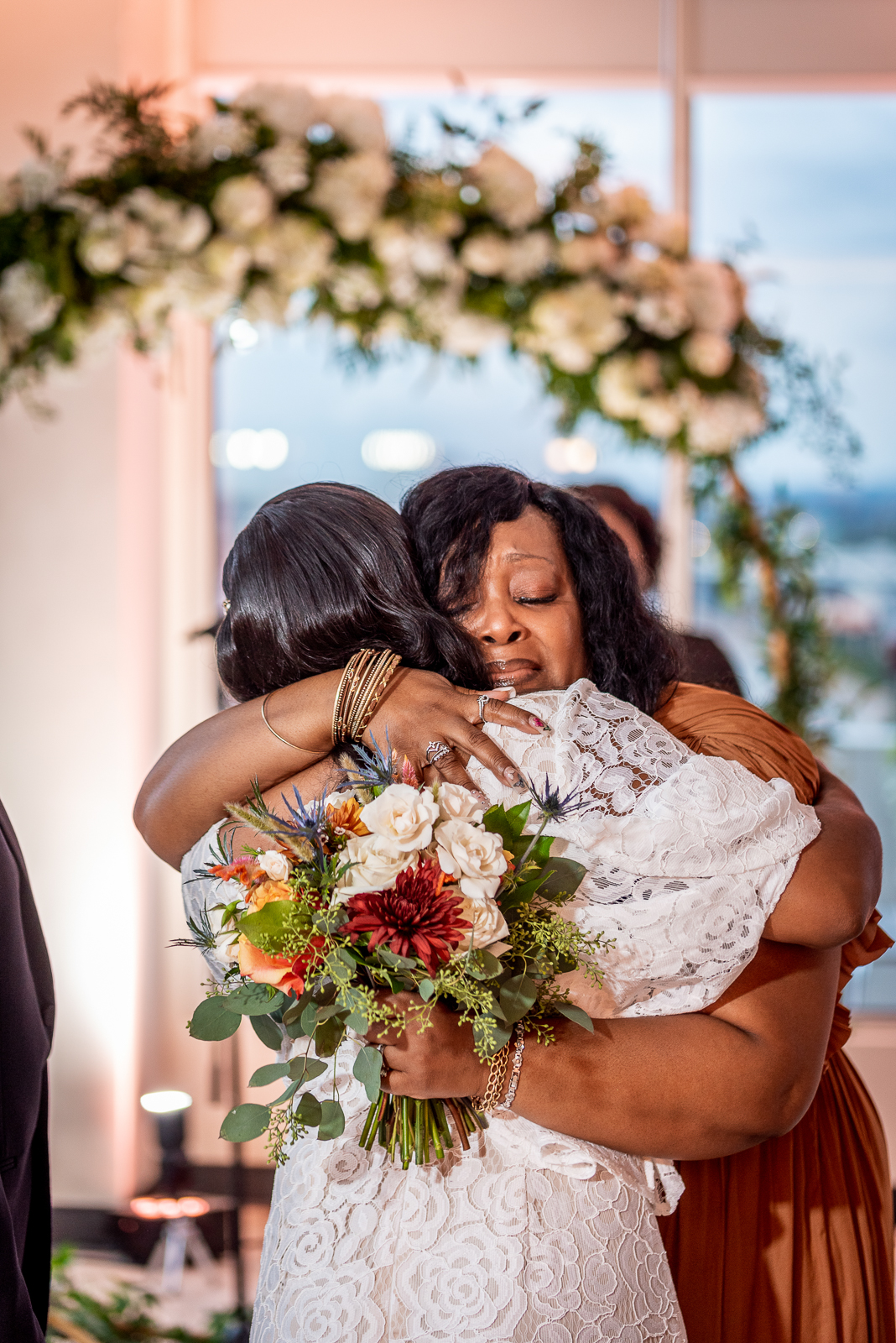 Bride with mom, hug, cry, sweet, candid wedding photo, African American bride, African American wedding, urban wedding ceremony at Penthouse Events, Ohio City, Cleveland Flats