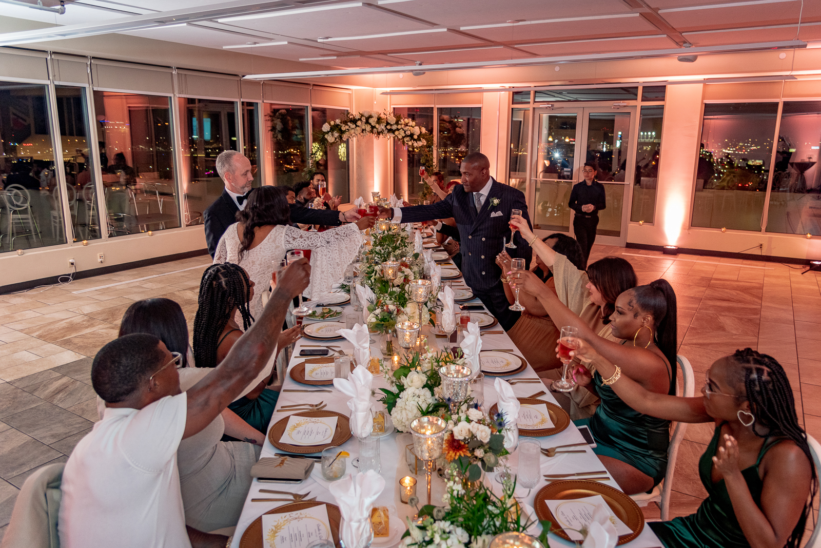 Wedding toast, bride and groom, bride's father, pink light, pink uplighting, African American wedding, romantic, urban wedding reception at Penthouse Events, Ohio City, Cleveland Flats