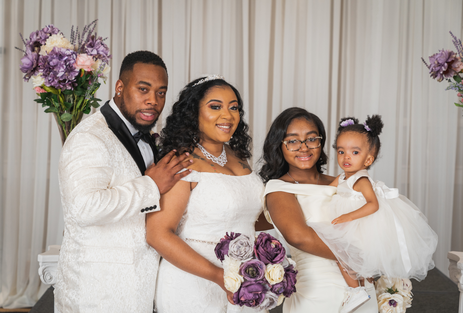 Bride and groom with flower girl, bridal party portrait, family portrait, African American bride, African American wedding, romantic wedding ceremony at Hilton Akron/Fairlawn