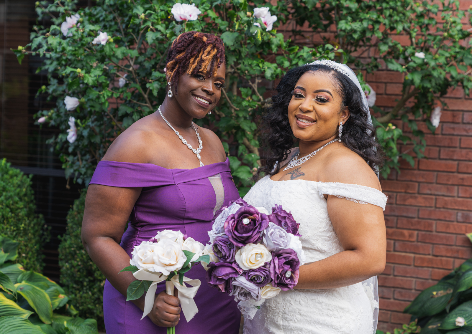 Bride with bridesmaid, bridal party portrait, African American bride, African American wedding, romantic wedding ceremony at Hilton Akron/Fairlawn