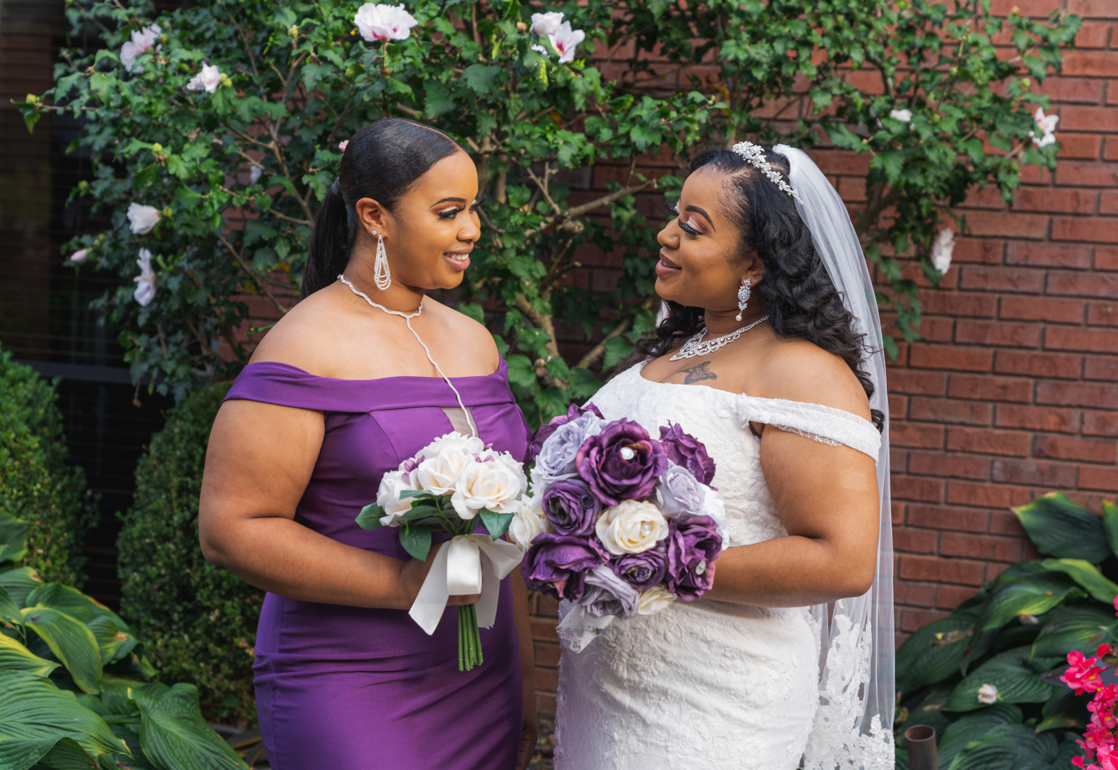 Bride with bridesmaid, bridal party portrait, African American bride, African American wedding, romantic wedding ceremony at Hilton Akron/Fairlawn