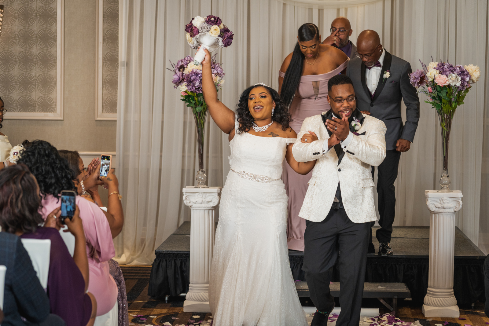 Bride and groom cheer, wedding recessional, beautiful African American bride, African American wedding, romantic wedding ceremony at Hilton Akron/Fairlawn
