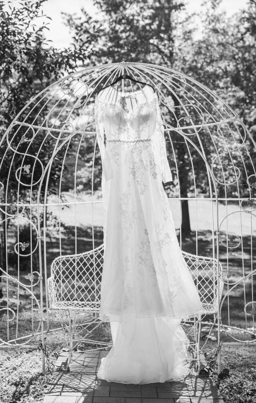 Wedding dress, unique wedding dress photo, metal bench, metal arch, black and white, classic, beautiful, fall wedding, cute outdoor wedding ceremony at Grand Pacific Wedding Gardens