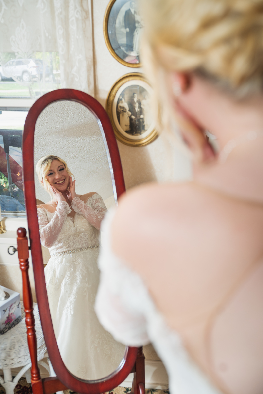 Bride smiling in mirror, getting ready, wedding preparation, hair and makeup, wedding dress, fall wedding, cute outdoor wedding ceremony at Grand Pacific Wedding Gardens