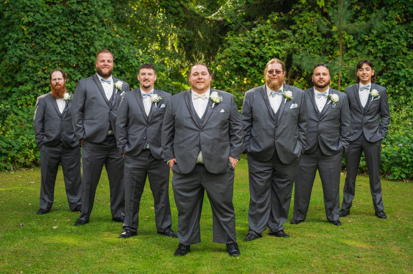 Groom and groomsmen, bridal party portrait, green, trees, nature, outdoor September wedding ceremony at Westfall Event Center