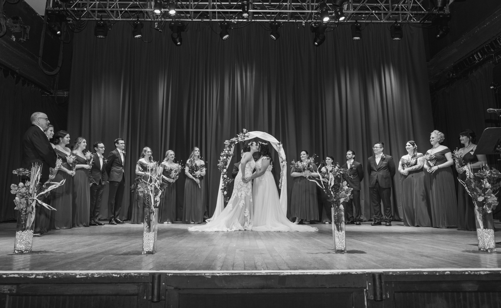 Two brides kiss at wedding ceremony, black and white, beautiful, classic, two wedding dresses, love is love, beautiful lesbian wedding at the House of Blues