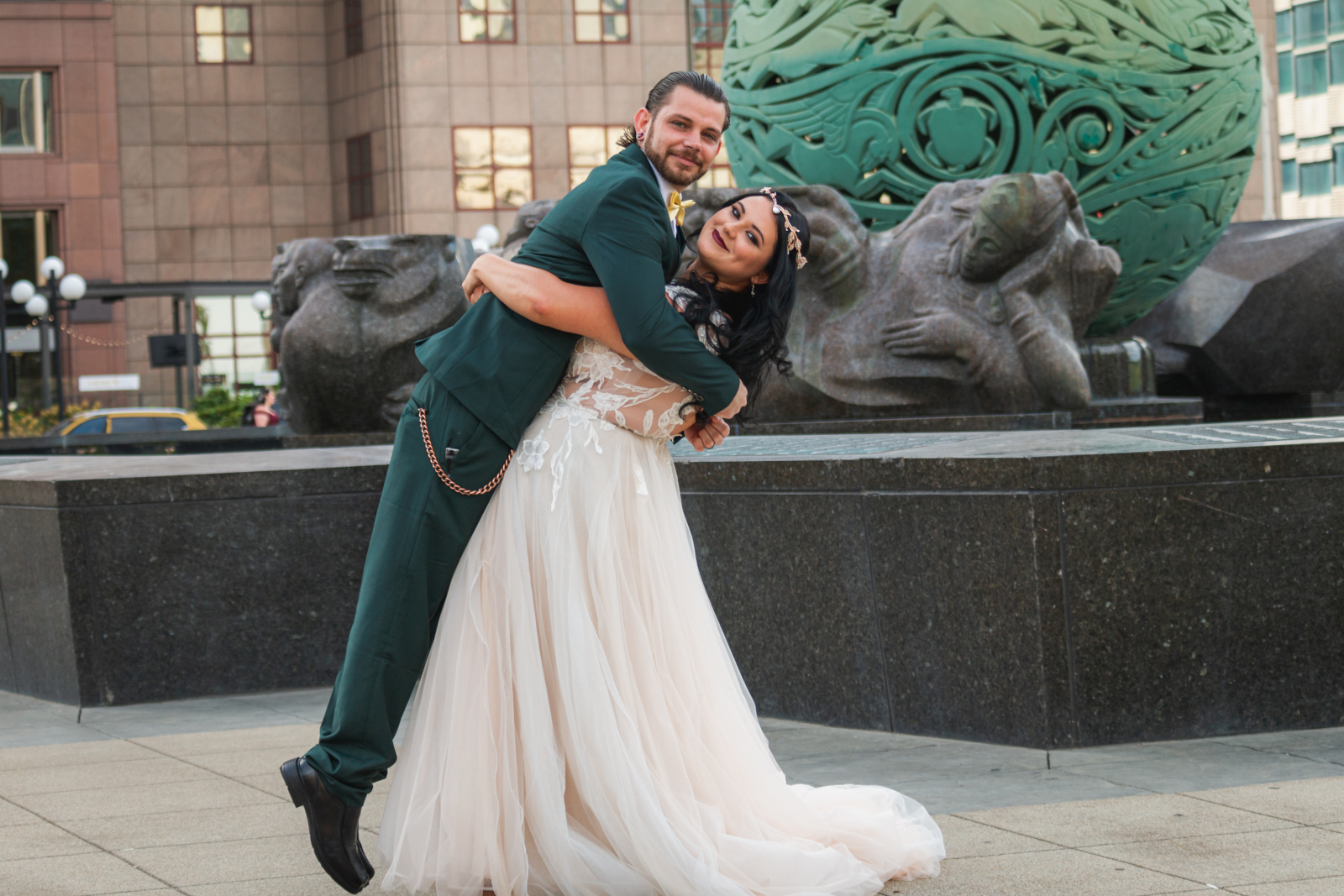 Two brides with groomsman, bridal party portrait, fun bridal party portrait, funny, mixed bridal party, two wedding dresses, love is love, beautiful lesbian wedding ceremony at House of Blues Cleveland, downtown Cleveland, Fountain of Eternal Life