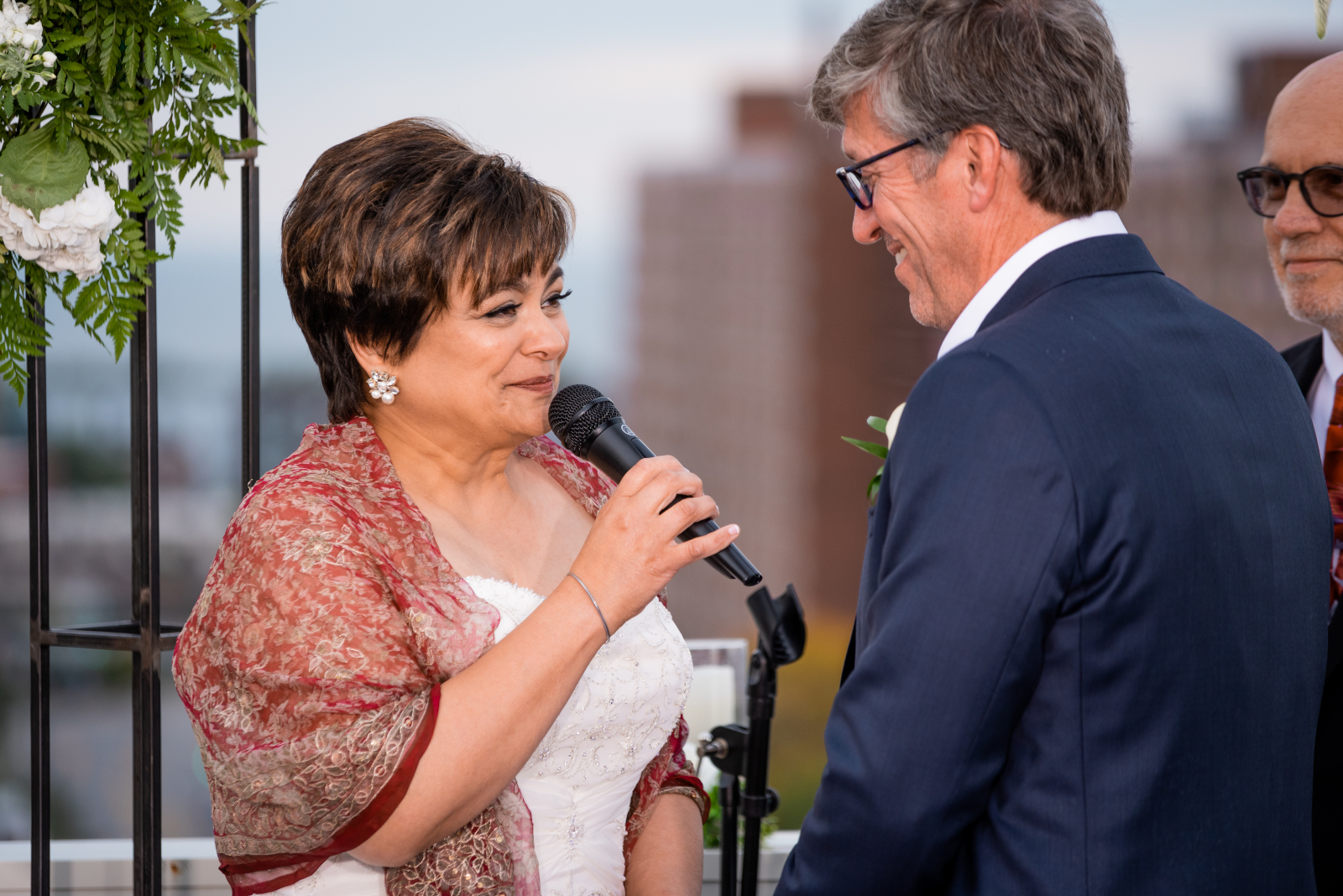 Bride saying vows, smiling, sweet wedding photo, older couple, romantic outdoor urban wedding ceremony at Penthouse Events, Ohio City, Cleveland Flats