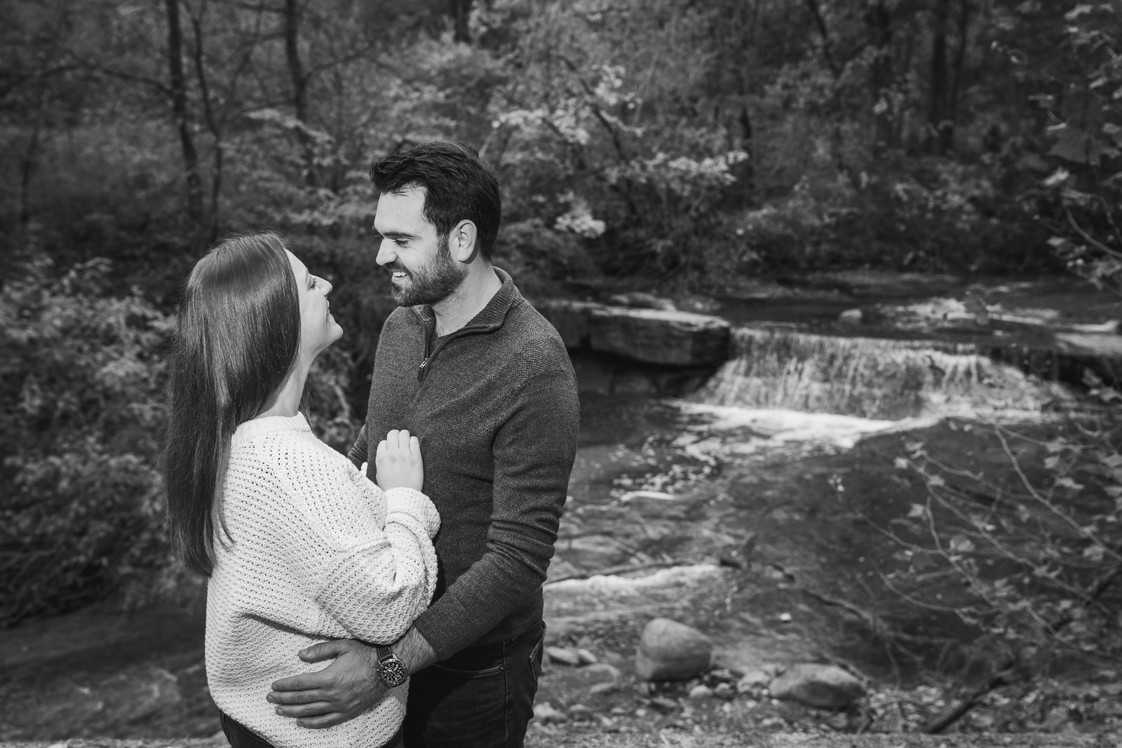 Man and woman fiancee engagement photo, outdoor, nature, forest, creek, waterfall, outdoor fall engagement photo session at Tinkers Creek, Bedford Reservation, Cleveland Metroparks