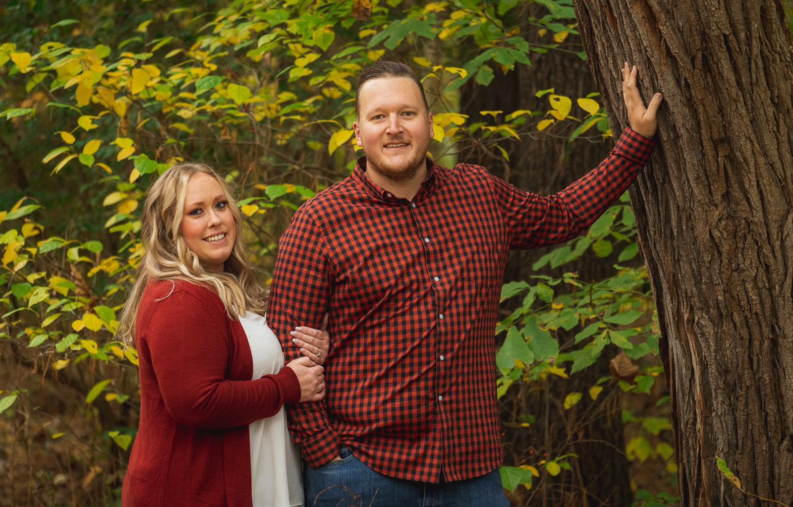 Man and woman fiancee engagement photo, outdoor fall engagement photo session at Everett Road Covered Bridge