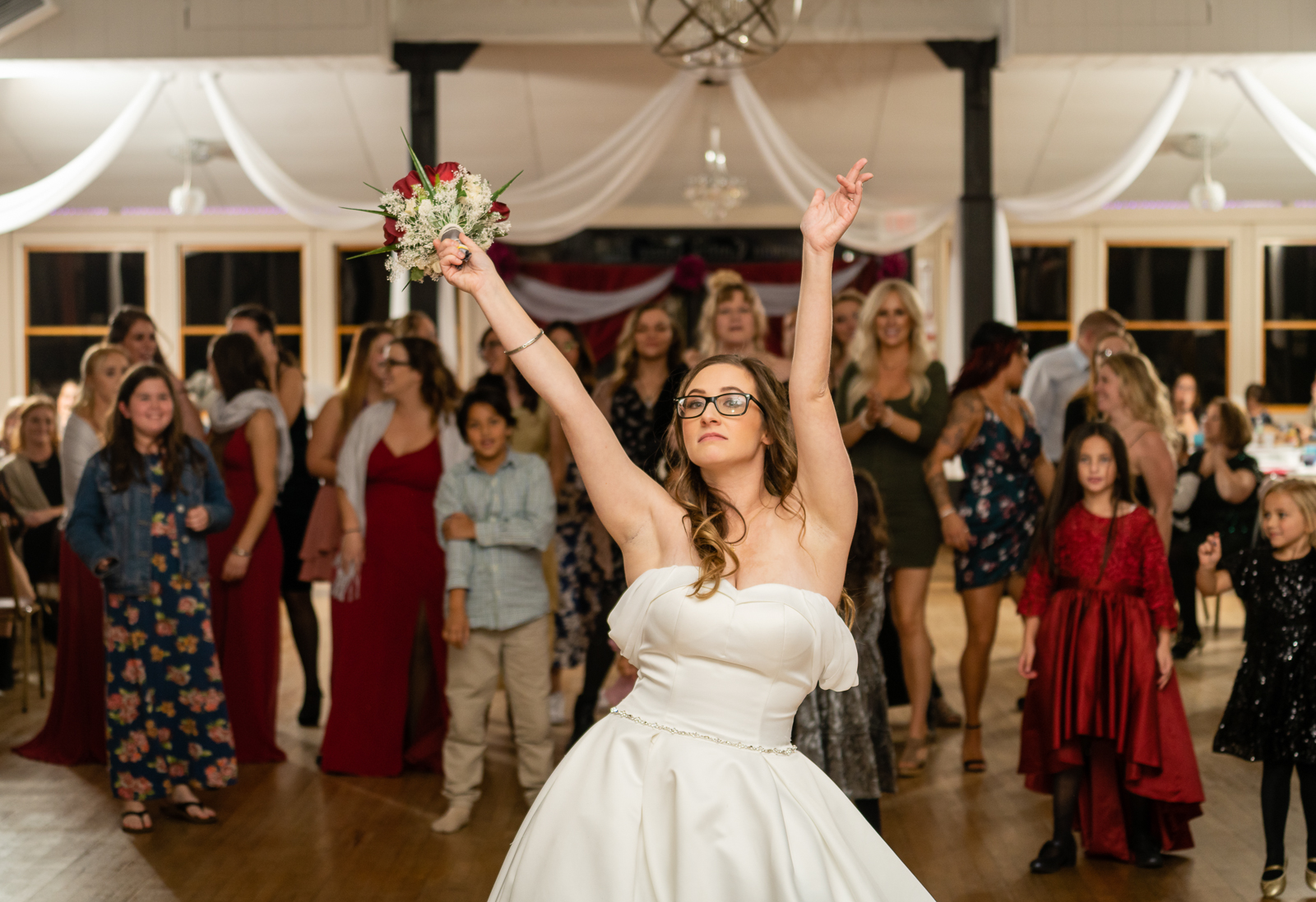 Bride, bouquet toss, wedding reception at German Central Organization