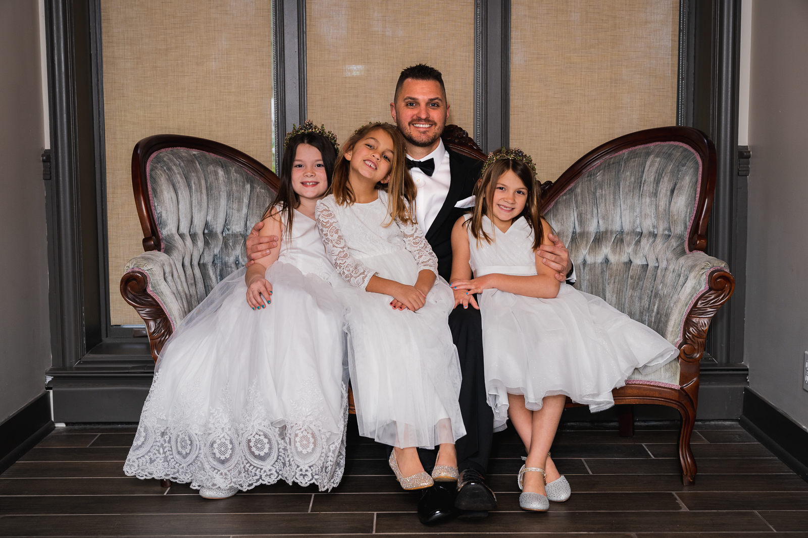 Groom and daughters, flower girls, bridal party portrait, before wedding ceremony at Gather at the Lakes