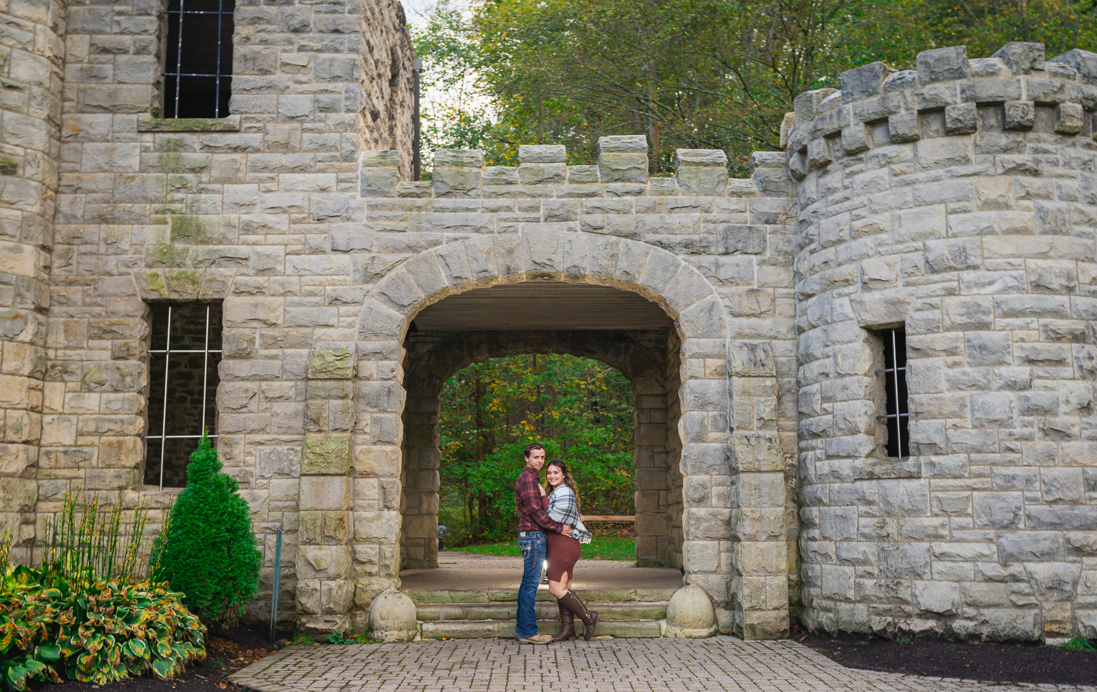 Man and woman fiancee engagement photo, outdoor fall engagement photo session at Squire's Castle, Cleveland Metroparks