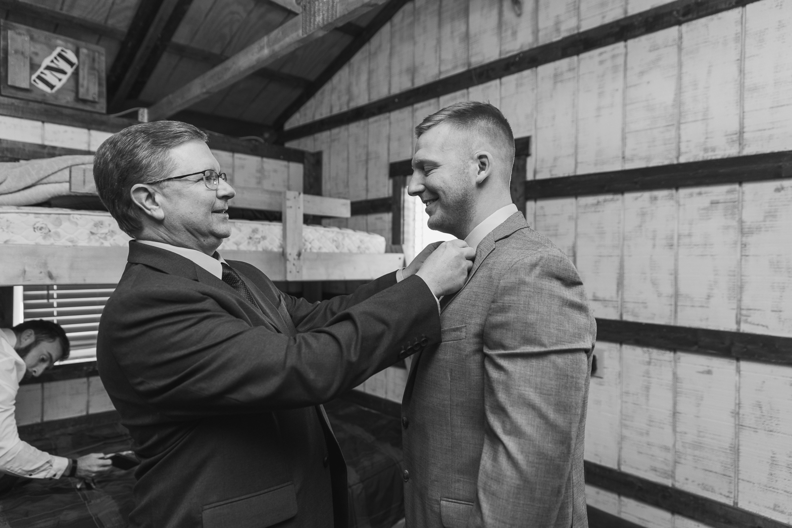 Groom with bride's father, getting ready, wedding preparation, tie, candid, fall wedding, rustic outdoor wedding ceremony at White Birch Barn