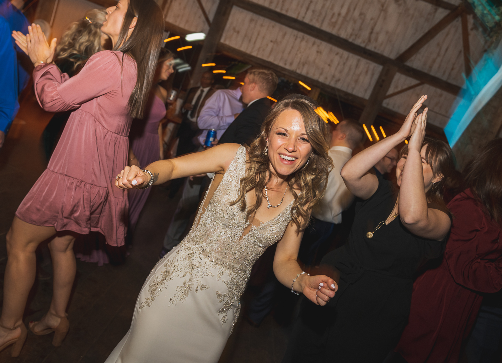 Bride, dance, music, DJ, fun, rustic wedding reception at White Birch Barn