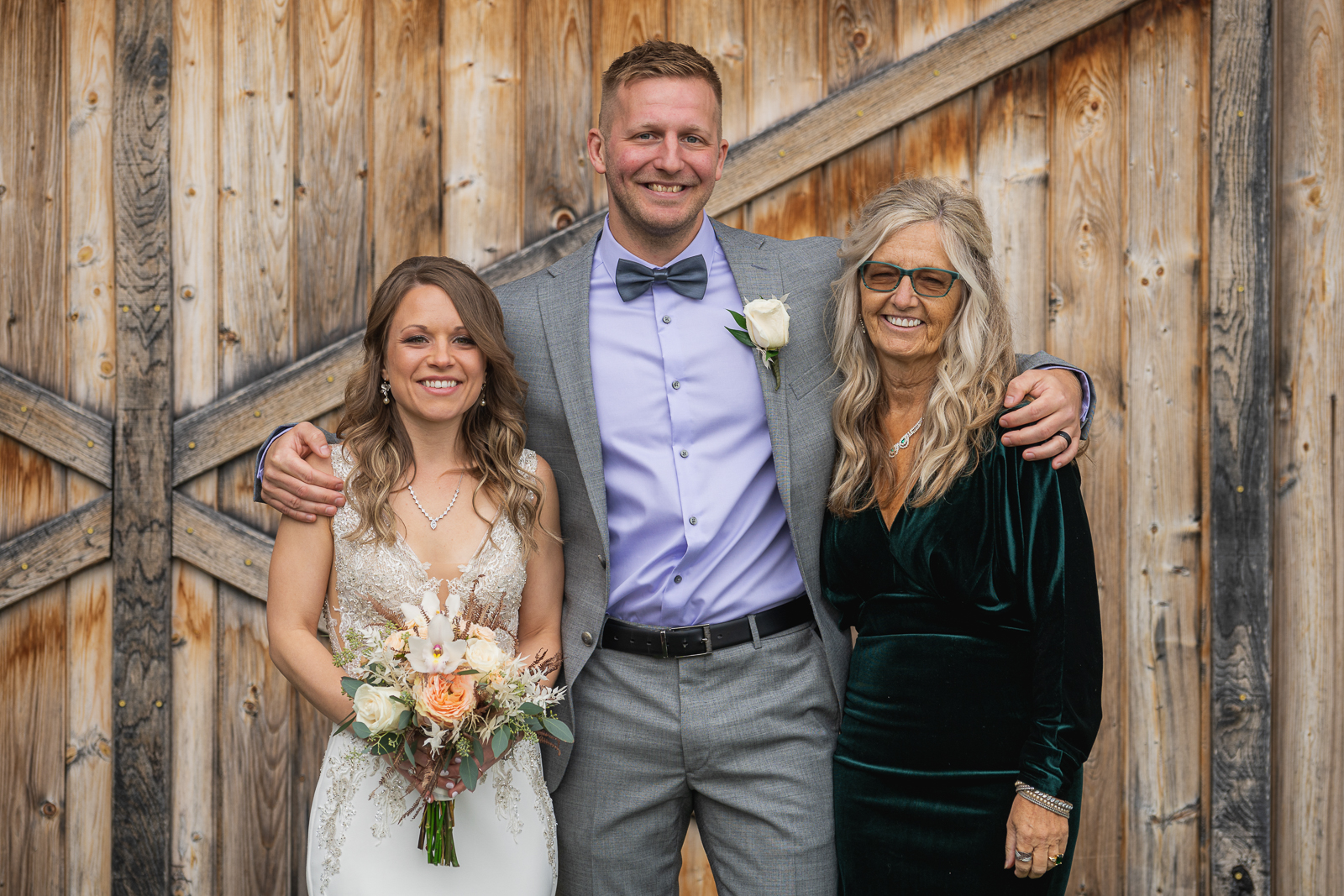 Bride and groom with groom's mom, family portrait, wedding photo, fall wedding, rustic outdoor wedding ceremony at White Birch Barn